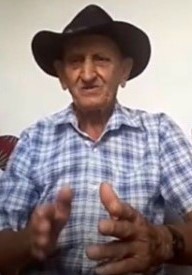 Pedro Carneiro de Oliveira, o Pedro de Elias, 81, guarda na memória, versos do canto da bandeira. Reprodução do zoom